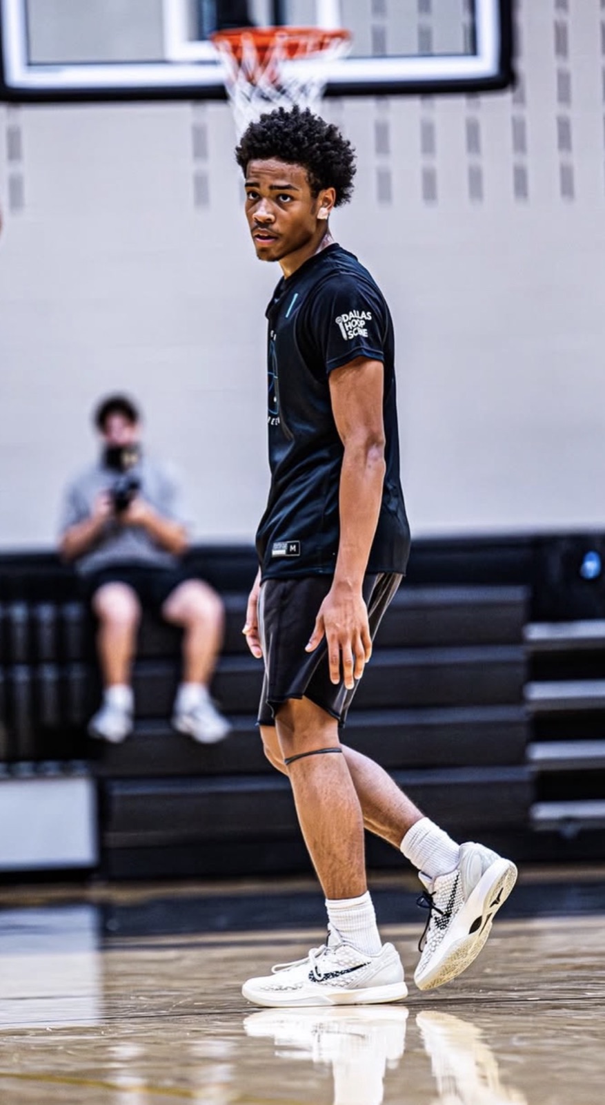 Player looking back over his shoulder, the DHS logo sharp on the left sleeve